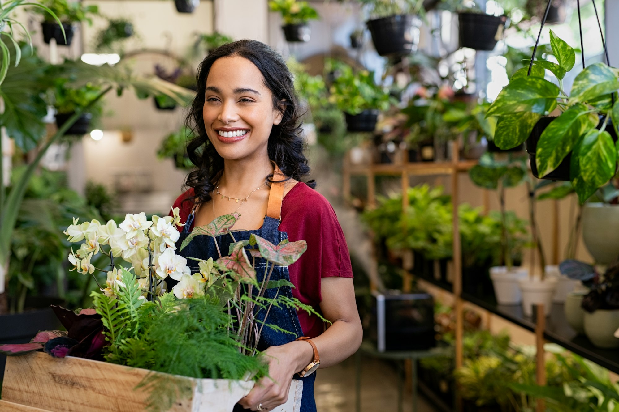 Happy smiling woman working in botany shop